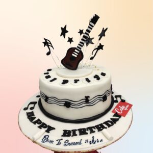 Sensational Music Theme Birthday Cake 1 Kg decorated with colorful fondant musical instruments, dancing music notes, and a personalized musical score border.