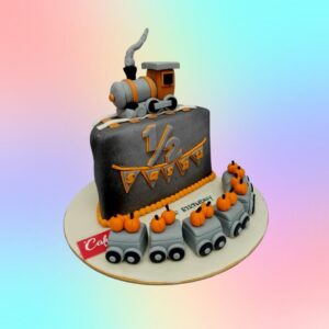 "Train Theme Half Birthday Cake 1 Kg with colorful train decorations, perfect for a fun half-birthday celebration."