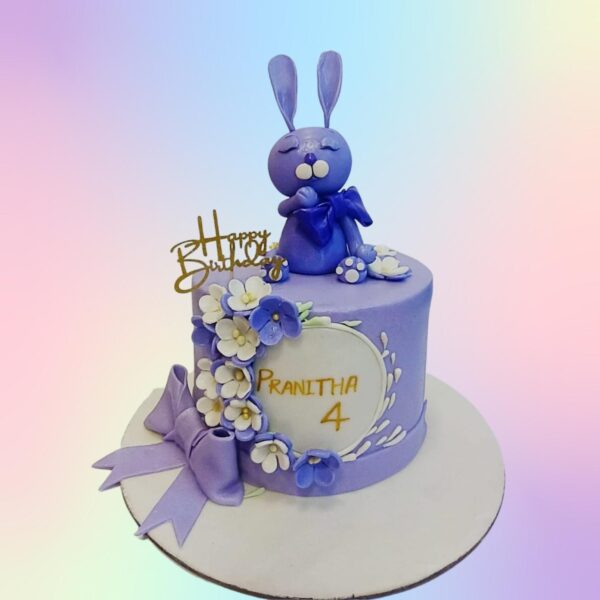 Vibrant Violet Rabbit Theme Kids Birthday Cake 1 Kg Single-tier purple cake with fondant rabbit ears, carrot decorations, and floral accents