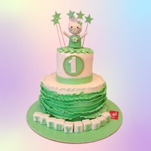 Amazing Green Hello Kitty First Birthday Cake 3 Kg in green, featuring Hello Kitty designs and decorations, perfect for a charming celebration.