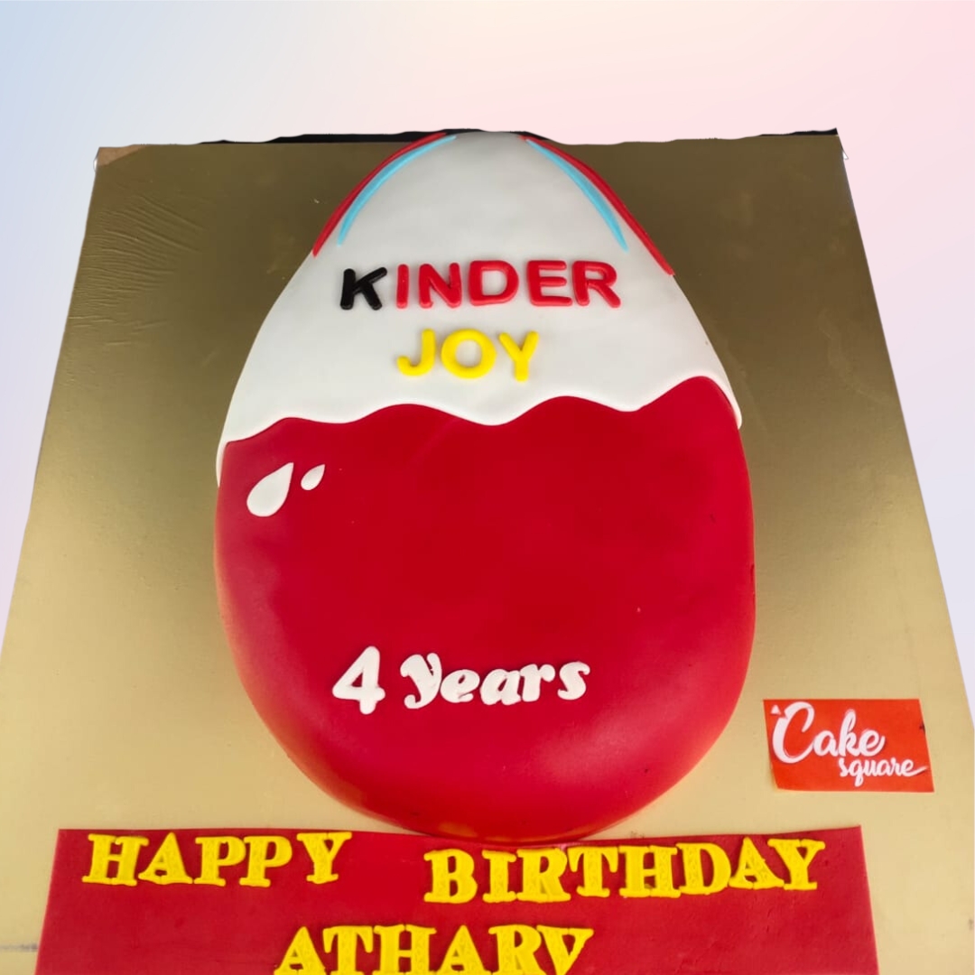 Amazing Kinder Joy Fans Birthday Cake 2 Kg. Chocolate cake decorated with Kinder Joy eggs, candies, and signature Kinder colors