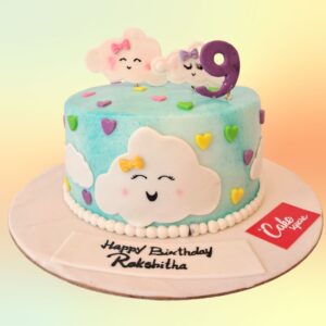 Amazing Puffy Cloud Kids Birthday Cakes 2 Kg. Whimsical cake designed to look like fluffy white clouds with rainbow accents for a child's birthday