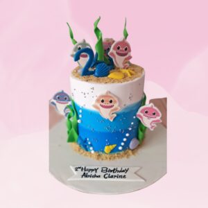 Adorable Best 1 Kg Baby Shark Theme Birthday Cake featuring friendly shark characters, ocean waves, and underwater decorations