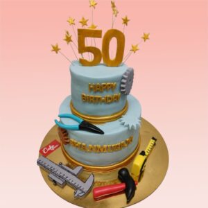 Innovative Best 50th Birthday Engineer Theme Cake featuring blueprint designs, miniature tools, and a "50" made of gears