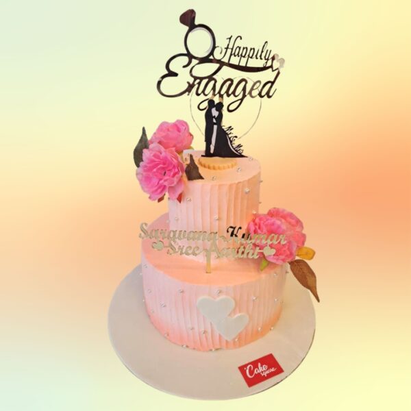 Best Happily Engaged Engagement Cake 4 Kg with white and gold marble effect, decorated with "Happily Engaged" script topper and fresh pink roses.