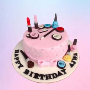 Best Prettiest Makeup Lovers Birthday Cake 1 Kg. Elegant cake decorated with edible makeup items like lipsticks, brushes, and eyeshadow palettes