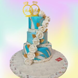 Best Rings Theme Engagement Cake 7 Kg with white and gold tiers, decorated with intertwined fondant rings and cascading sugar flowers.