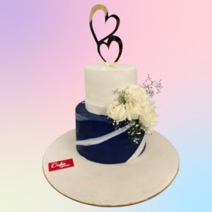 Best Stylish Engagement Cake 3 Kg. Elegant 3 kg engagement cake with metallic gold tier, white ruffles, and fresh roses, topped with a sparkling "Engaged" sign.