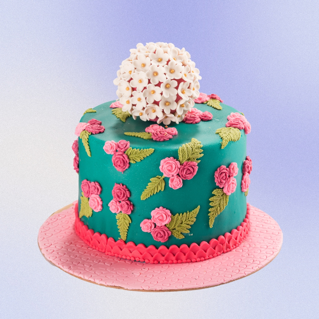 Charming Womens Birthday Cake 2 Kg. Elegant floral-themed cake with pastel colors and gold accents for a woman's birthday