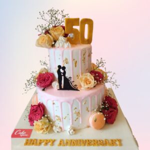 "Creamy 2 Tier Love Theme 3 Kg Anniversary Cake in fresh fruit flavour, featuring a layered design for a luxurious celebration."