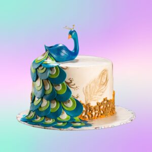 Extraordinary Peacock Birthday Cake for Her 2 Kg. Vibrant cake decorated with a colorful fondant peacock and feather designs