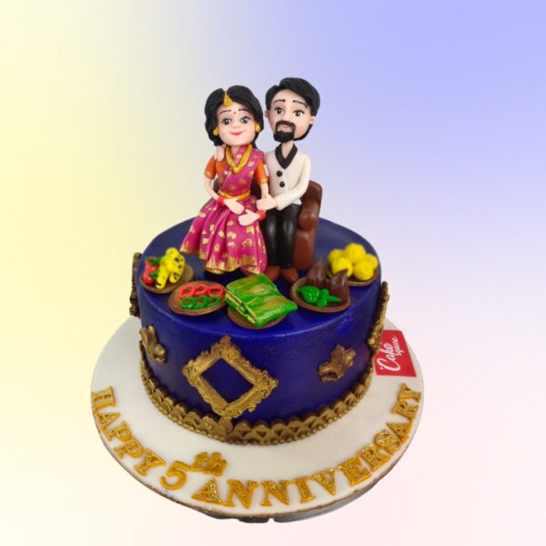 A perfect couple on a perfect blue cake made with chocolate and a traditional design Gifting 1 kg Anniversary Cakey by Cake Square Team is perfect for your family