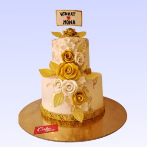 Golden Beauty Engagement Cake 4 Kg with metallic gold fondant, white sugar lace details, and a cascade of edible golden roses.