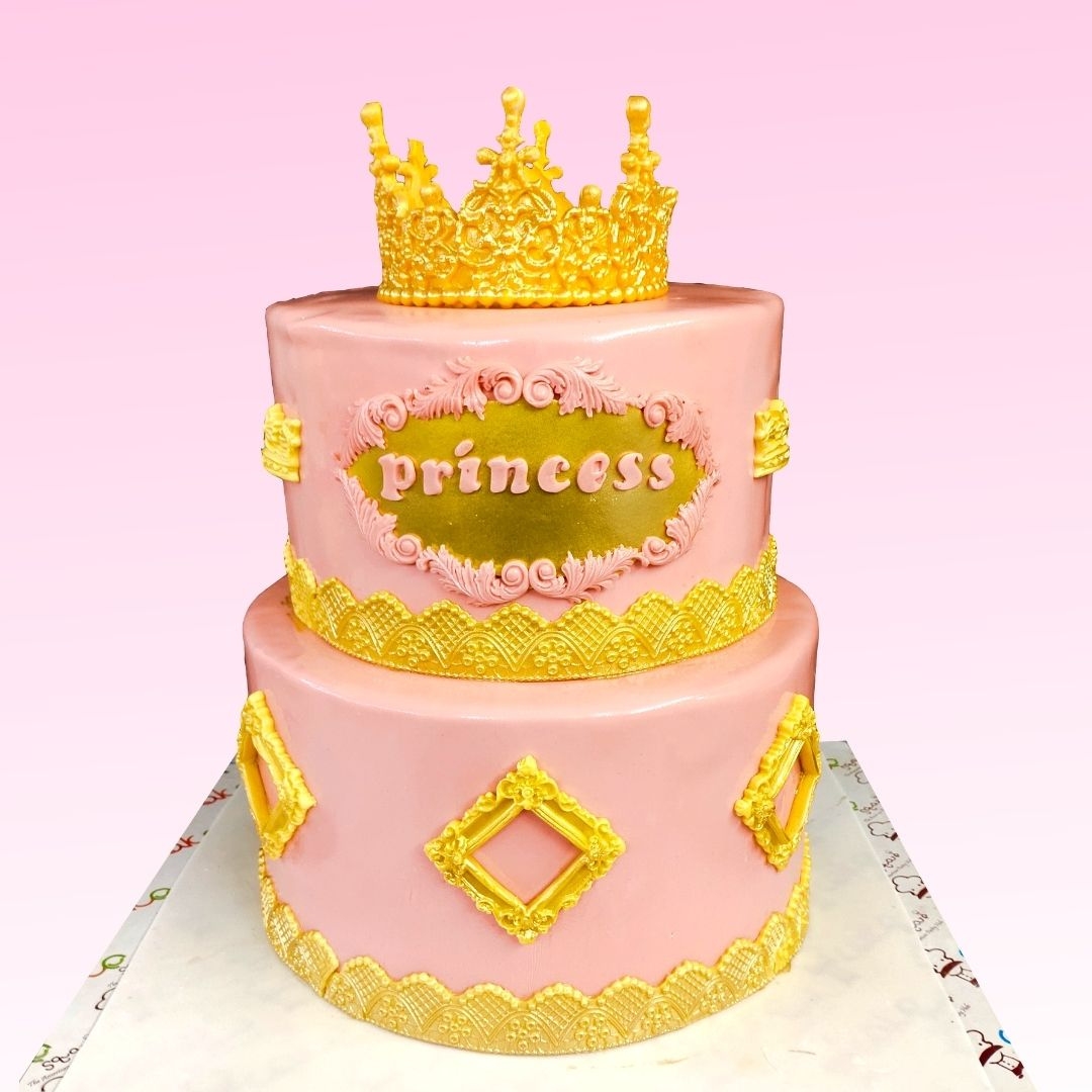 Golden Pink Crown Girls First Birthday Cake 5 Kg. Luxurious pink and gold tiered cake topped with a large edible crown for a baby girl's first birthday