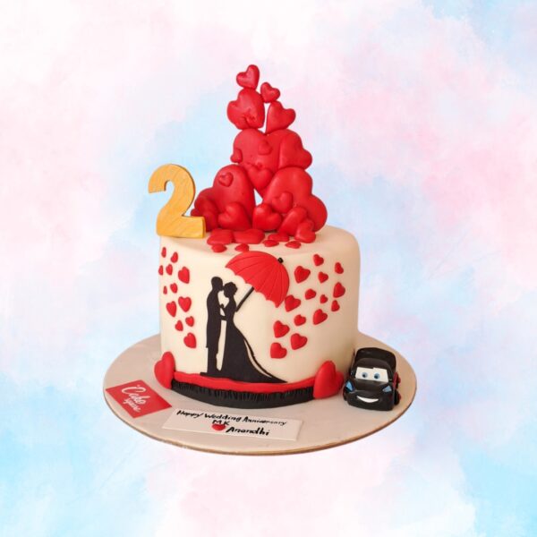 "Heart To Heart Second Anniversary Theme Cake 1 Kg in Black Forest flavor, featuring romantic heart decorations for a loving celebration."