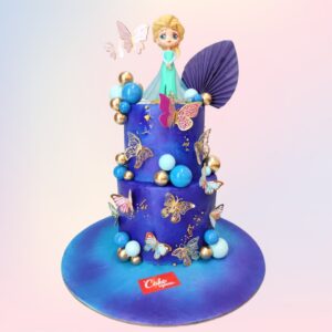 Icy Blue Frozen Theme Girls First Birthday Cake 5 Kg. Luxurious blue-toned tiered cake with Frozen-inspired elements and "1st Birthday" decorations