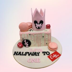 "Minnie Theme Girls Half Birthday Cake 1 Kg featuring cute Minnie Mouse decorations, perfect for a playful half-birthday celebration."