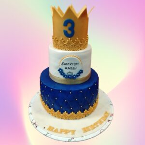 New Crown Birthday Cake 5 Kg with golden crown topper and regal purple and gold decorations.