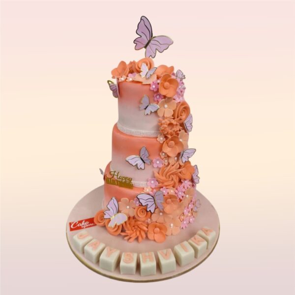 Peach Butterfly First Birthday Cake 6 Kg. Large tiered cake in soft peach tones with cascading edible butterflies for a baby girl's first birthday