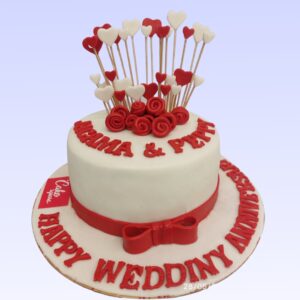 "Pretty Beautiful Red and White Heart Theme 1 Kg Anniversary Cake in chocolate truffle flavour, featuring a charming heart design."