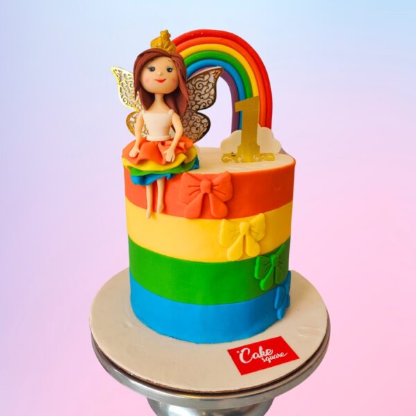 Rainbow Girl Kids Birthday Cake 2 Kg for girls, featuring vibrant rainbow layers and colorful decorations, perfect for a cheerful celebration.