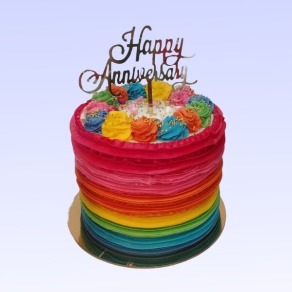 "Rainbow Theme 2 Kg Anniversary Cake in Black Forest flavour, featuring vibrant colors and a classic taste for a festive celebration."