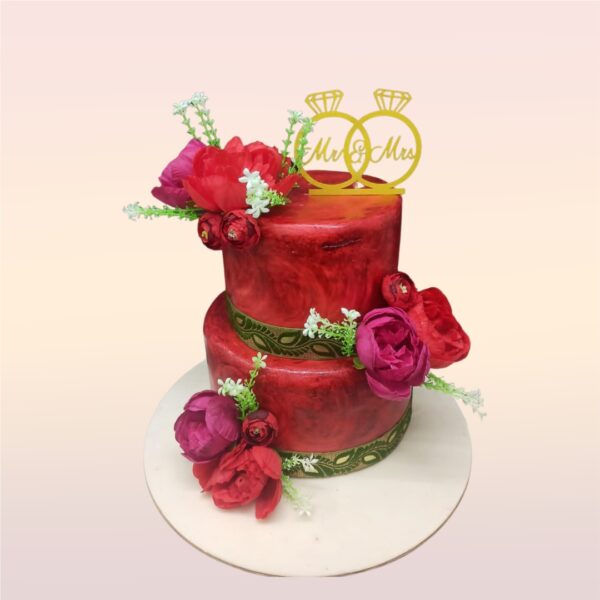 "Red Beauty 4 Kg 2-Tier Anniversary Cake in strawberry flavour, featuring an elegant red design for a memorable celebration."