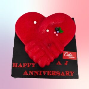 "Red Colour Holding Hands 2 Kg Anniversary Cake in red velvet flavor, featuring a romantic design of holding hands."