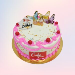 Delectable 1kg strawberry birthday cake with pink buttercream frosting and fresh strawberry toppings