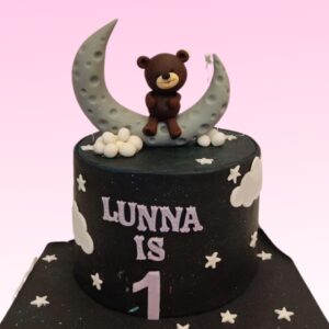 Teddy On The Moon Kids Birthday Cake 1 Kg with a moon design, featuring a cute teddy bear and moon decorations, perfect for a whimsical celebration.