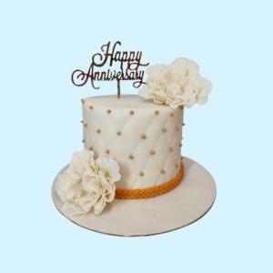 "White Gold Elegant Flower 1 Kg Anniversary Cake in chocolate flavour, featuring a sophisticated white and gold floral design."