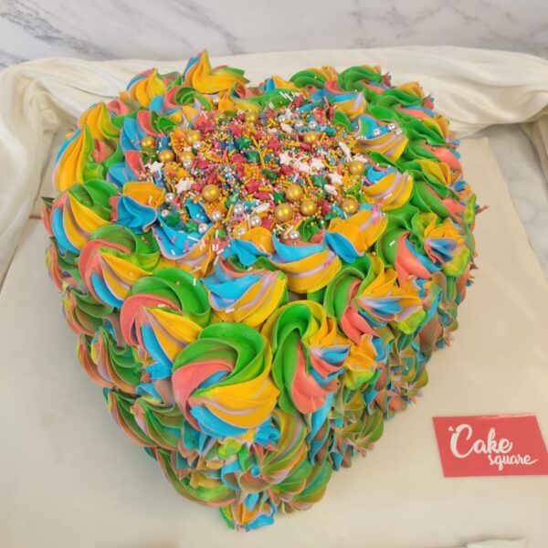 A bunch of colourful ruffles on a Colourful Heart 1 Kg Birthday Cake for a lovely persons Birthday cake or anniversary cake.