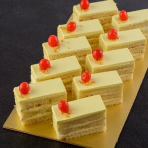 Butterscotch cake pieces 80 gms. Golden butterscotch cake slice with caramel drizzle, 80 grams.