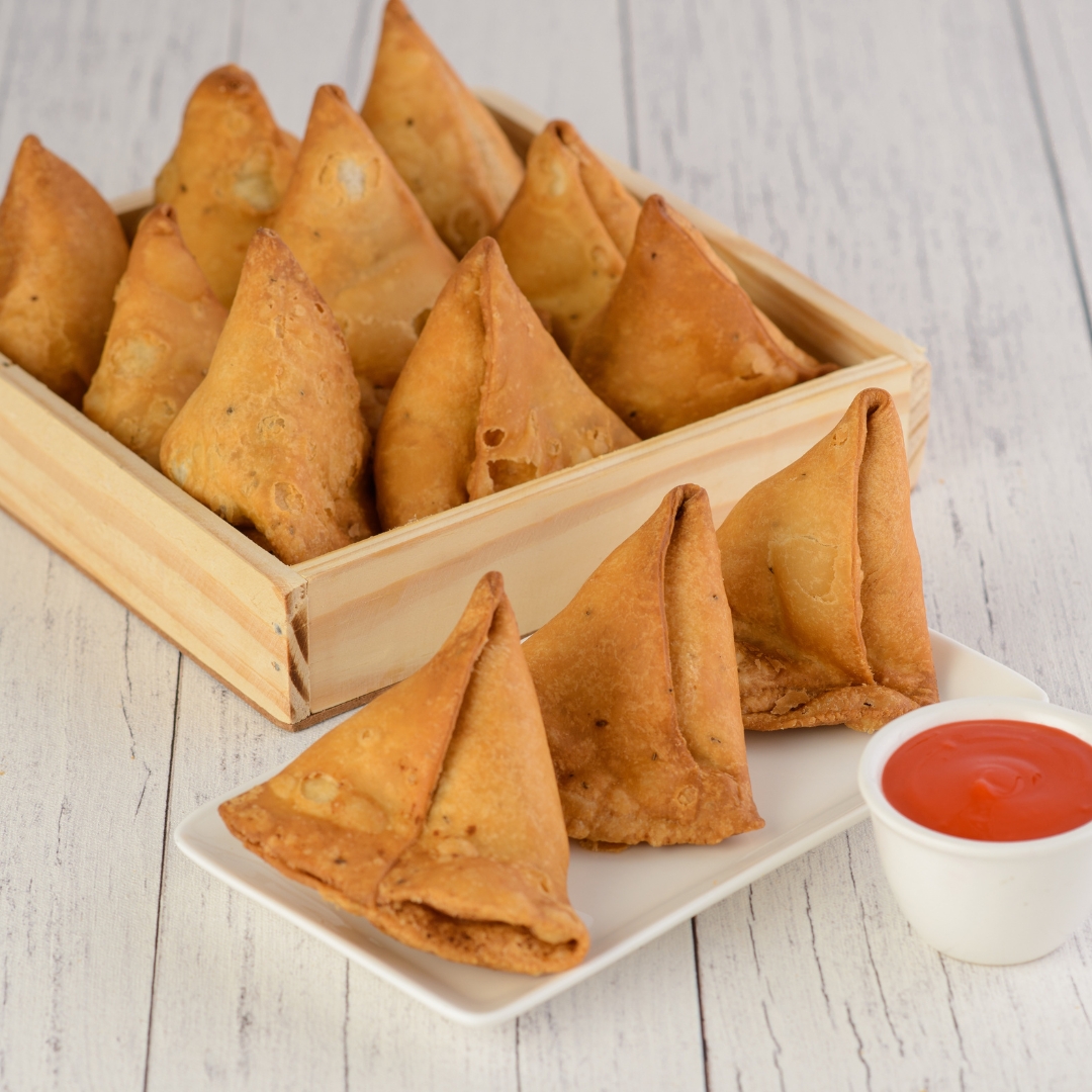 Buy Best Homemade Samosa. Golden, crispy homemade samosas with visible flaky layers.