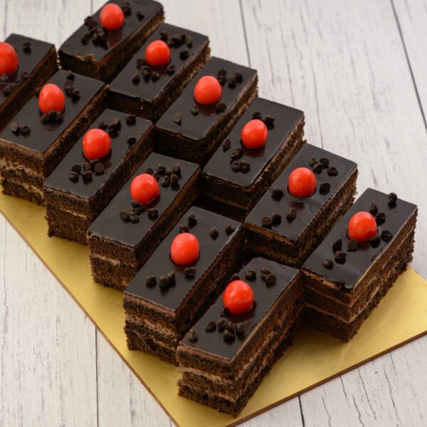 Chocolate Truffle piece cakes. Decadent chocolate truffle cake slices with rich ganache topping.