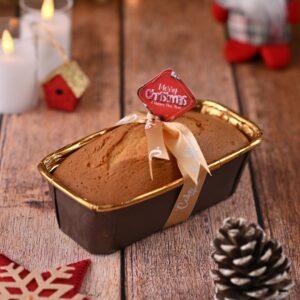 A Cheerful Christmas Gifting Tea Cake 400 gms beautifully packaged and displayed, ready to be gifted during the holiday season, showcasing its festive appeal.