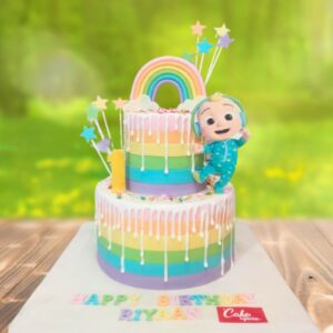 Amazing Rainbow Cocomelon Theme Girls First birthday cake 4 kg, featuring vibrant rainbow and Cocomelon decorations, perfect for a colorful celebration.