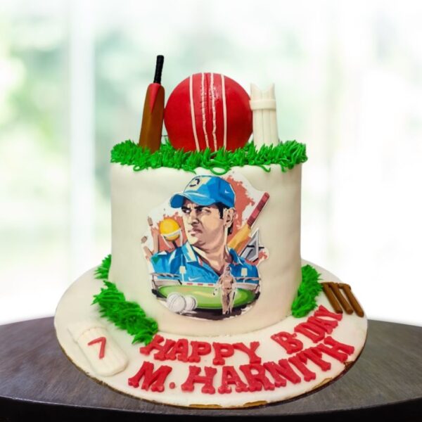 Awesome Dhoni cricket theme birthday cake 2kg. Vibrant 2kg Dhoni-inspired cricket theme birthday cake with bat and ball decorations