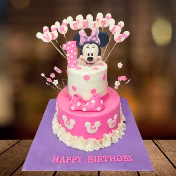 Awesome Minnie theme first birthday cake 3 Kg, featuring cute Minnie Mouse decorations and a vibrant design, perfect for a fun and joyful celebration.