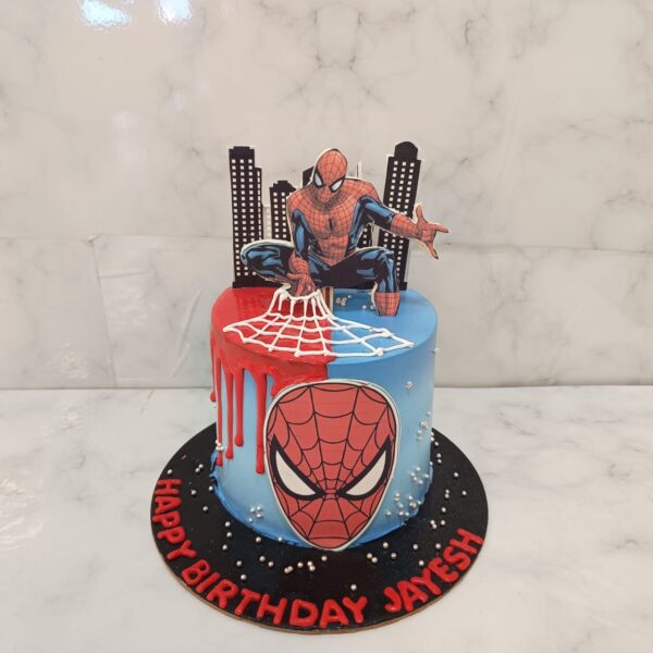 Colorful Best 2kg Spiderman theme birthday cake featuring iconic mask design, web details, and character figurine