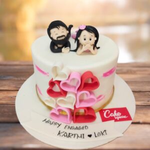 Lovers engagement theme cake 1 Kg with a lovers theme, featuring delicate heart decorations and soft pastel colors perfect for celebrating love.