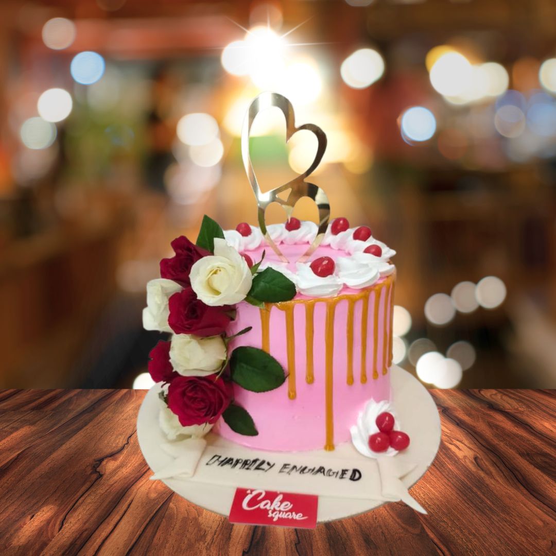 Perfect pink engagement cake 1 Kg with elegant floral decorations and a romantic design, ideal for celebrating a couple's special day.