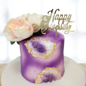 "Pretty Purple Anniversary Theme 1 Kg Black Forest Flavour Cake, featuring a charming purple design perfect for anniversary celebrations."