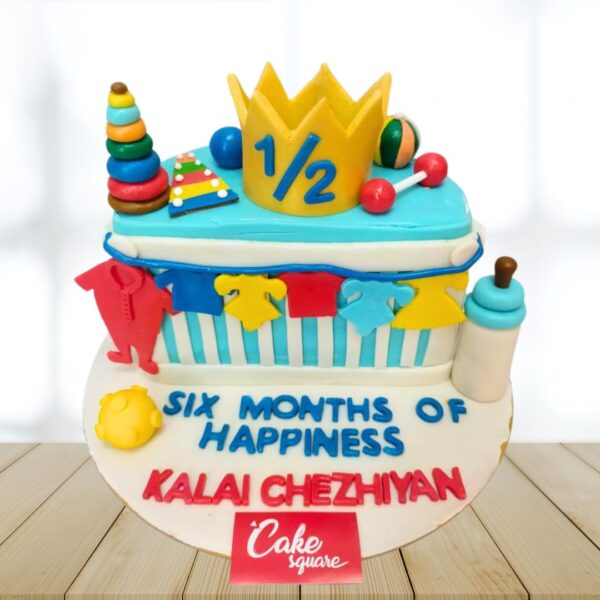 "Toys Half Birthday Cake 1 Kg featuring fun toy-themed decorations, perfect for a playful half-birthday celebration."