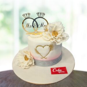 "White Premium Anniversary Cake 1 Kg, featuring an elegant design suitable for sophisticated celebrations."