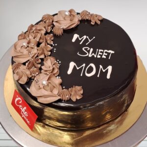 1kg Exotic Chocolate Mother's Day Cake decorations and rich chocolate frosting.