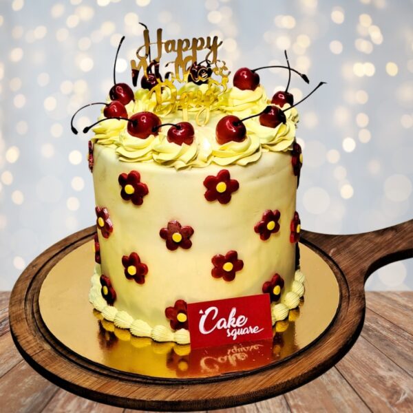 2 kg Flowers and Cherry Birthday Cake decorated with floral designs and fresh cherries.