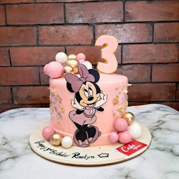 "Amazing Musical Minnie Birthday Cake 1 Kg. Round birthday cake decorated with Minnie Mouse theme, musical notes, and colorful accents"