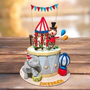 Amazing Circus Themed Birthday Cake 2 Kg with colorful tent design, playful animal figurines, and festive decorations