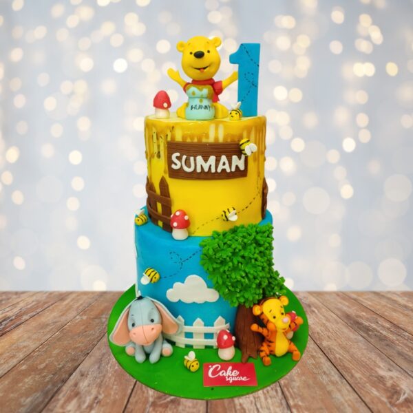 Awesome Winnie The Pooh 4 Kg First Birthday Cake with beloved character designs, honeypot accents, and Hundred Acre Wood-inspired decorations